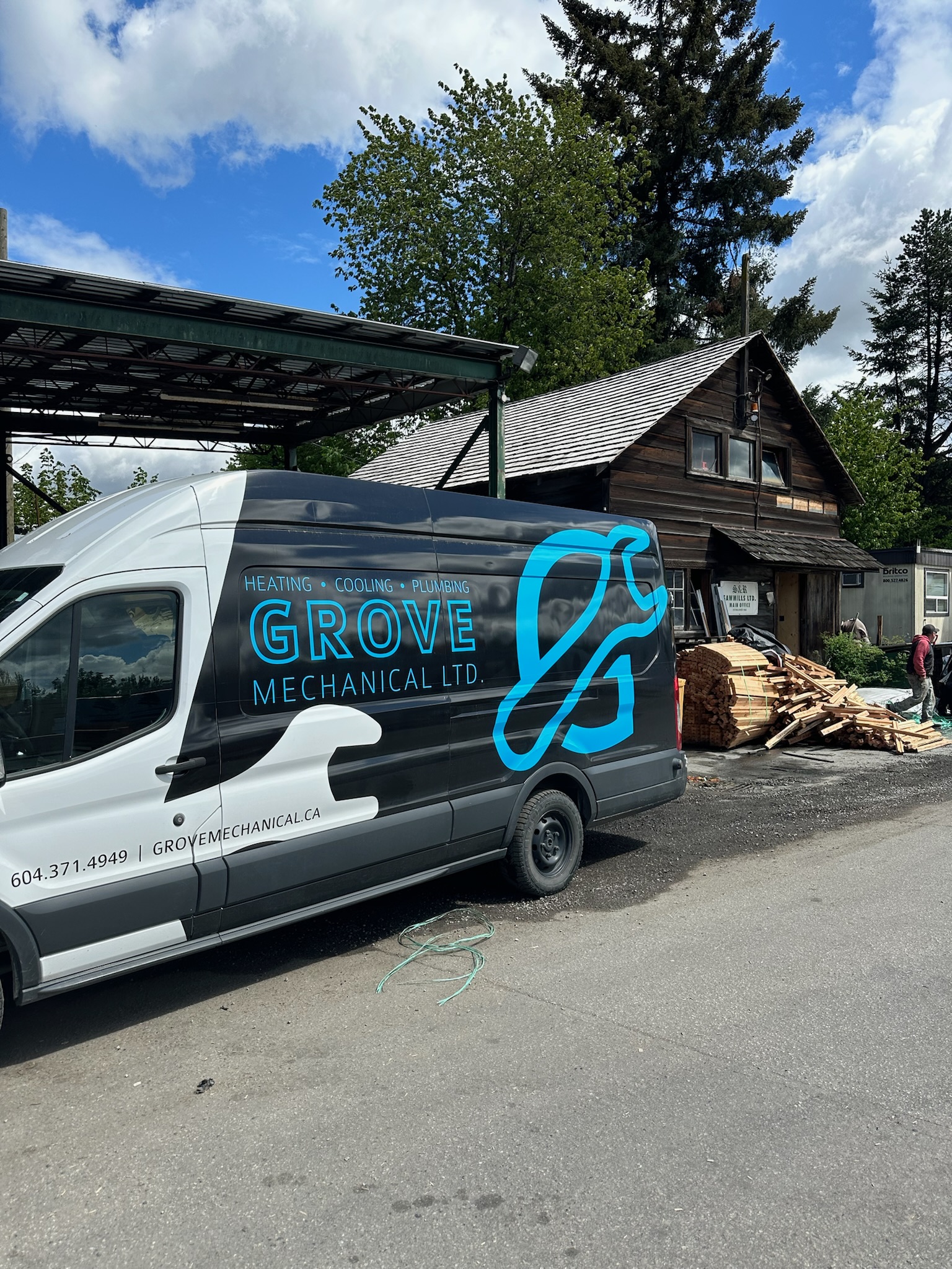 Grove Mechanical service van at a residential job site