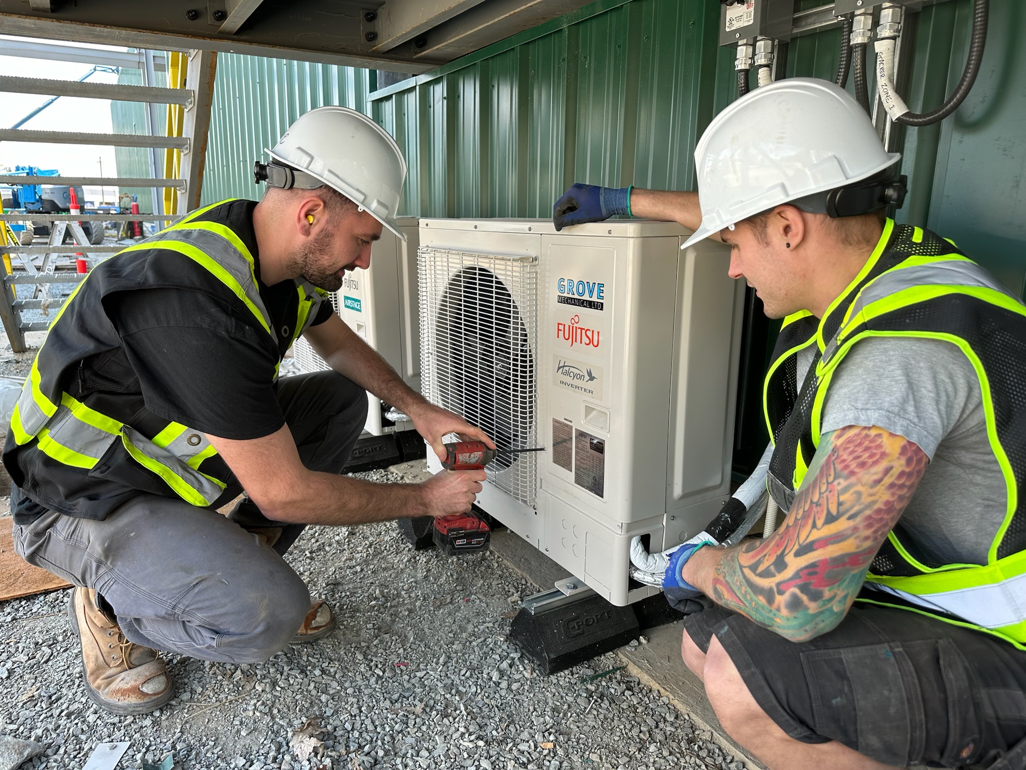 Grove Mechanical team installing commercial Fujitsu ducted system