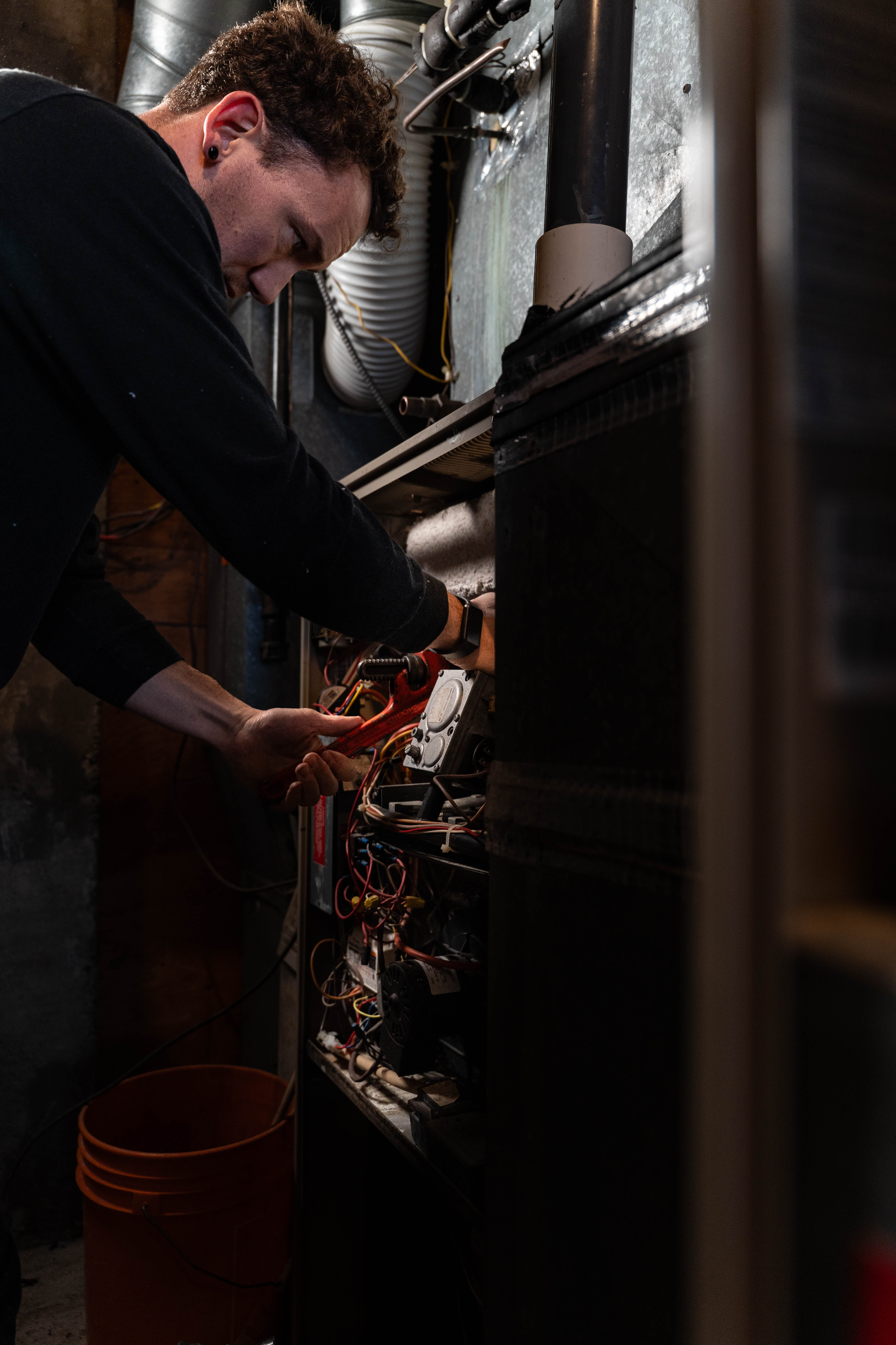 Grove Mechanical technician servicing furnace internals