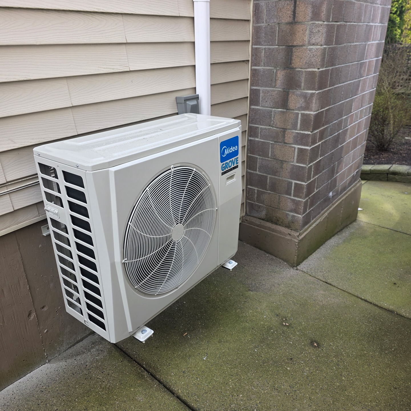 Grove Mechanical technician installing HVAC system in residential home