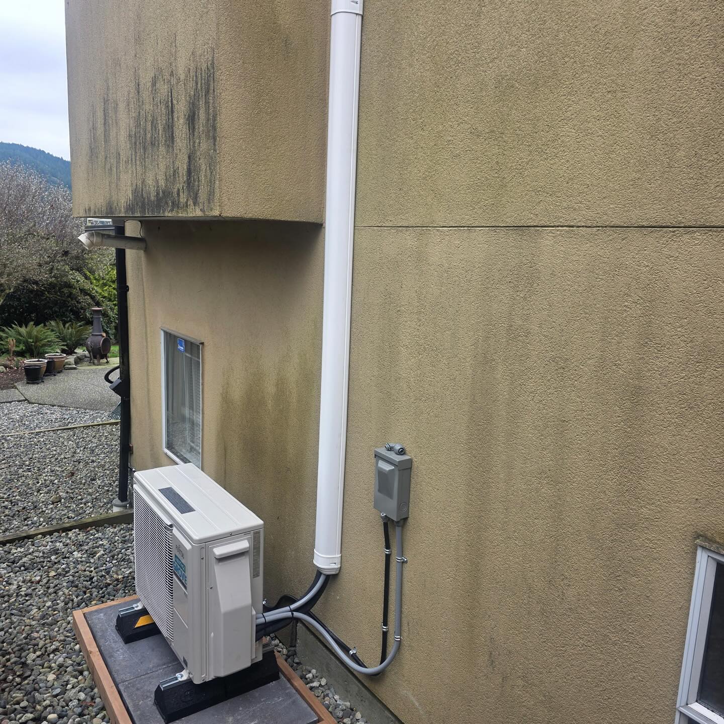 Grove Mechanical team installing commercial Fujitsu heat pump