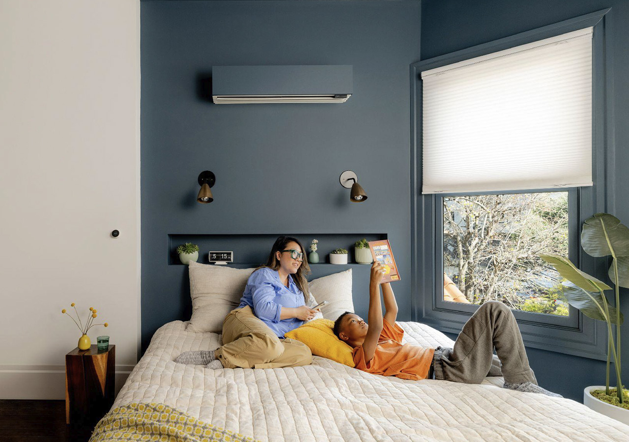 Quilt heat pump in a bedroom with blue accent wall